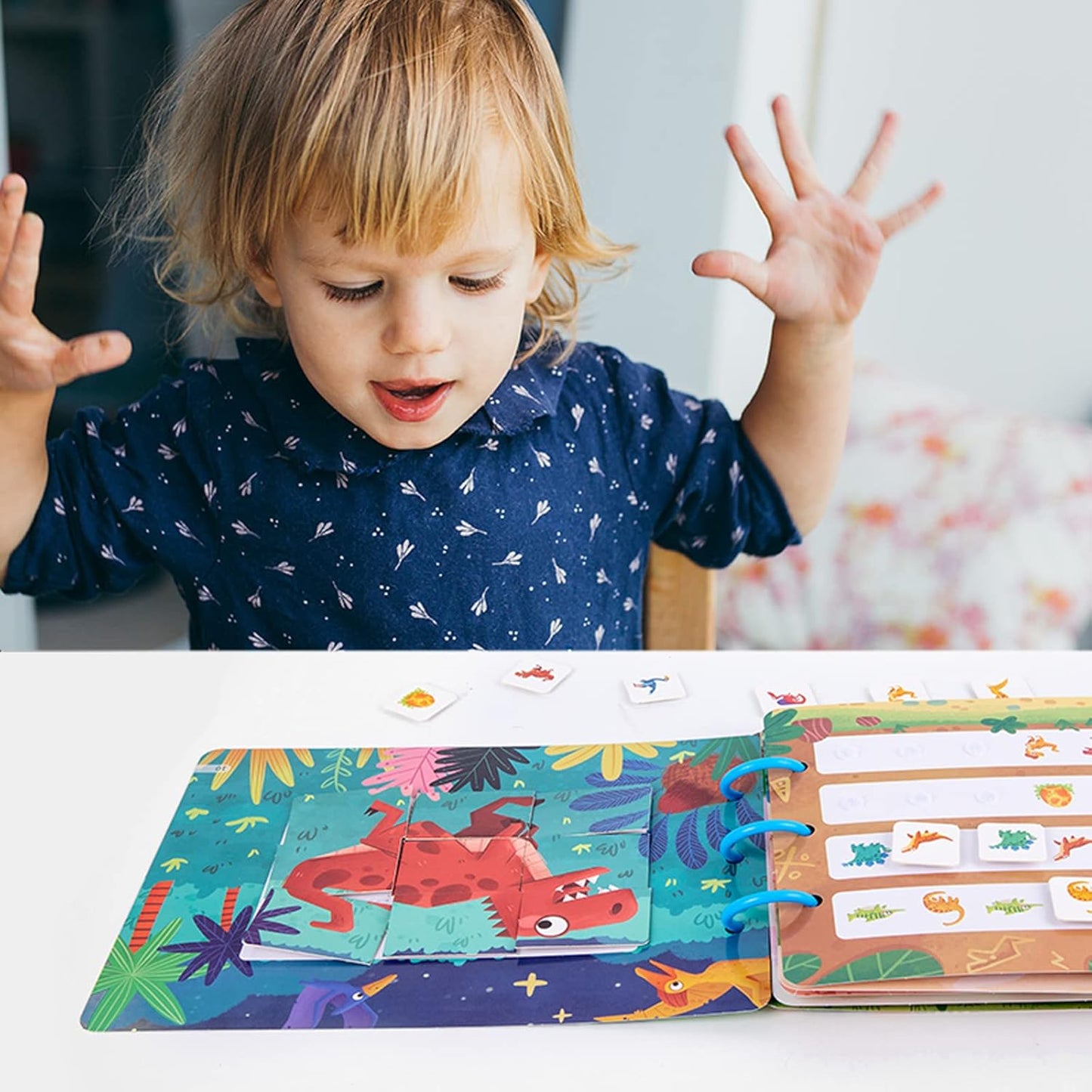 Child playing with quiet activity book