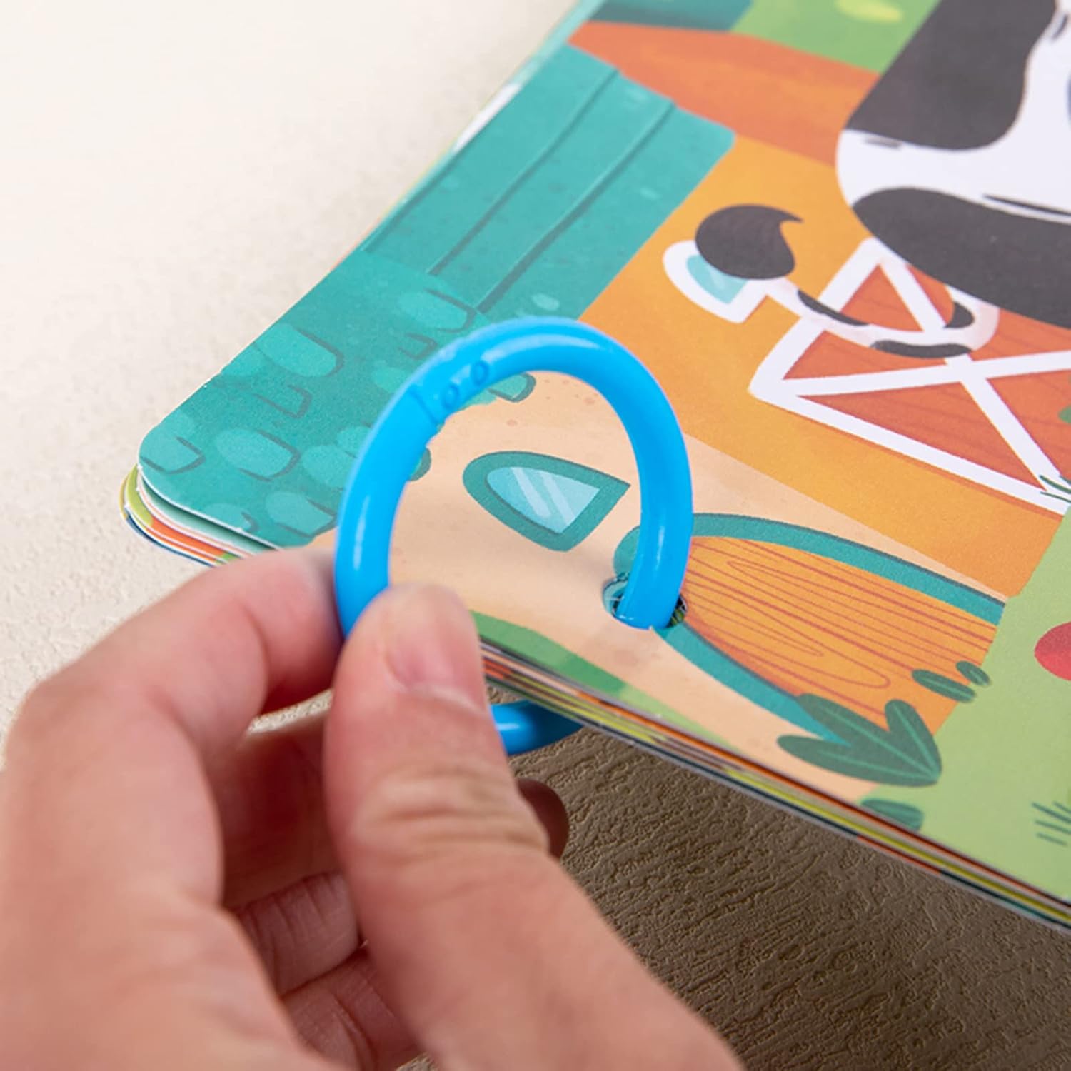 Child playing with quiet activity book