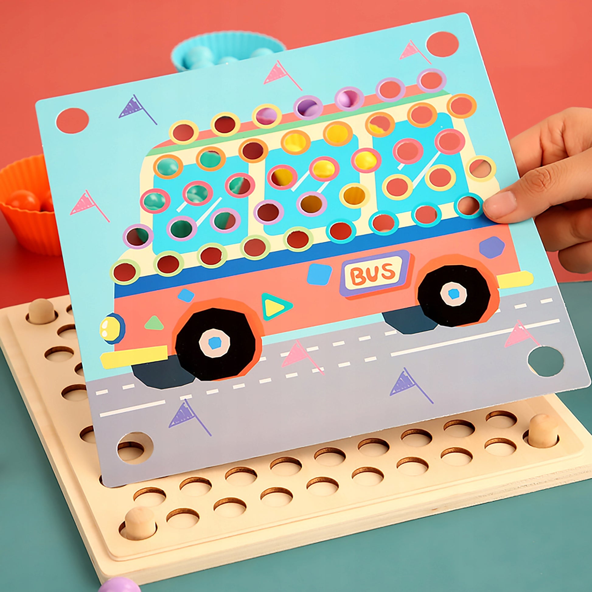 Child arranging bead clips for counting activity